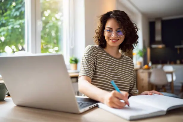 Professional working with a portrait image on a laptop